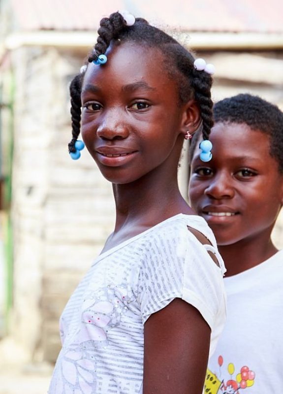 Higuey, Dominican Republic - November 19, 2014: portrait of smiling haitian children in refugee camp in Dominican Republic