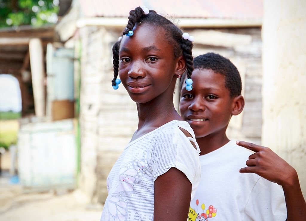 Higuey, Dominican Republic - November 19, 2014: portrait of smiling haitian children in refugee camp in Dominican Republic
